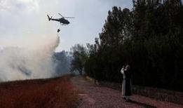 İsrail'de Kudüs ile Tel Aviv arasında 11 noktada devam eden orman yangınları endişe yaratıyor